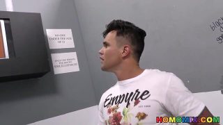 Ebony men interacting at a gloryhole