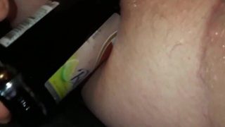 Cross Dresser tries to fuck herself with a beer bottle